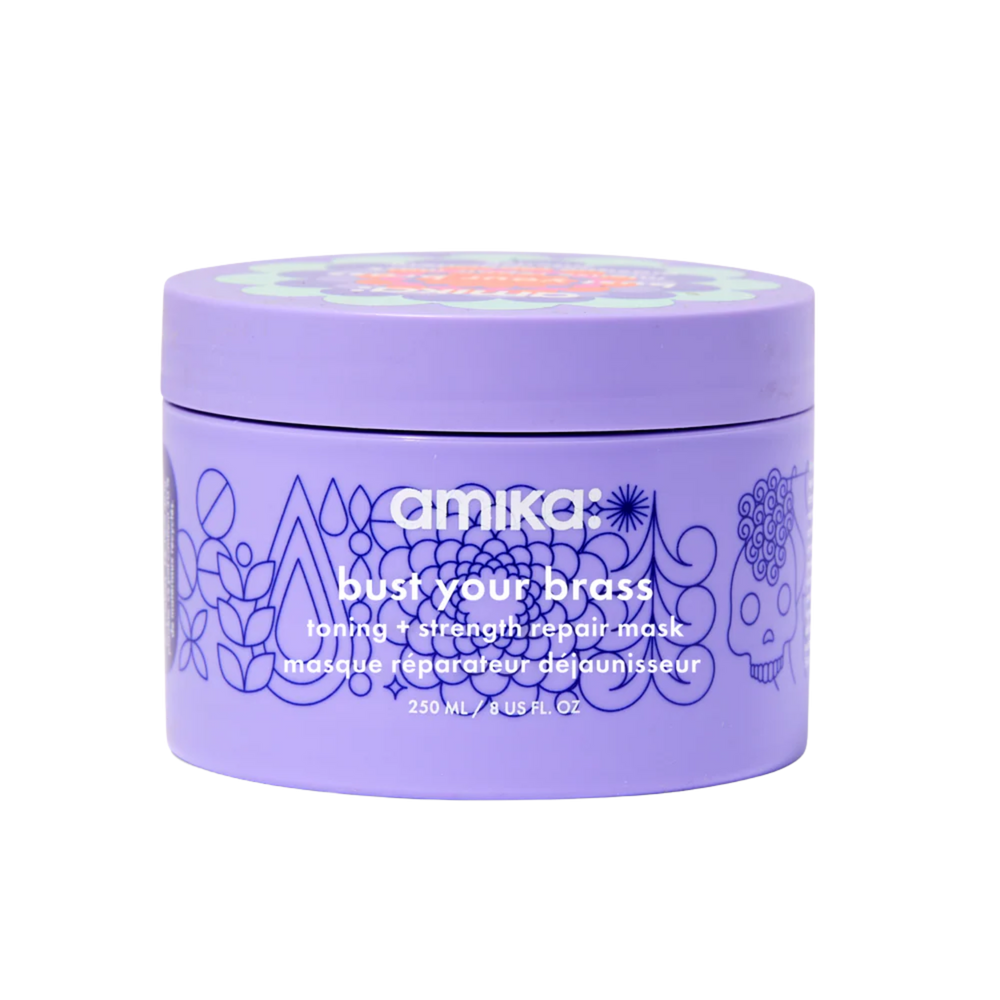 Pot du masque Amika Bust Your Brass posé sur fond blanc