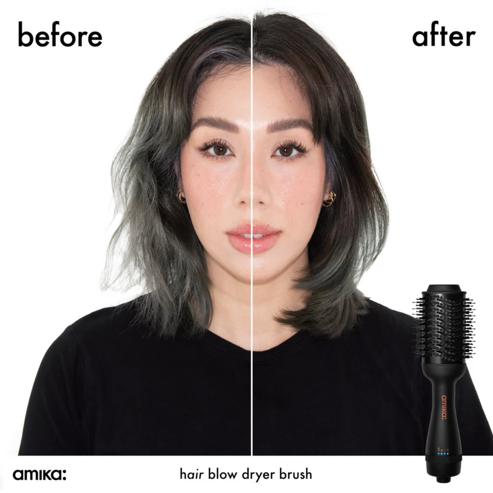 Brosse soufflante Amika HĒMĀIREM Blow Dryer Brush 2.0 posée sur fond blanc