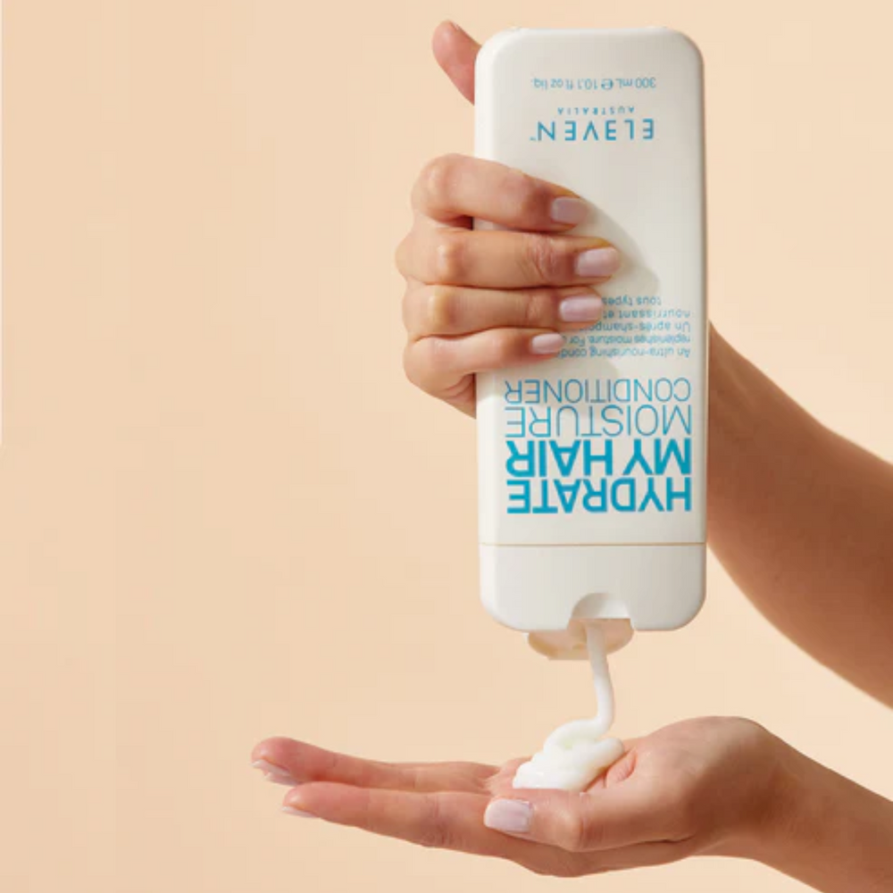 Flacon de l’après-shampoing Hydrate My Hair Moisture Conditioner d’ELEVEN Australia, texture crémeuse