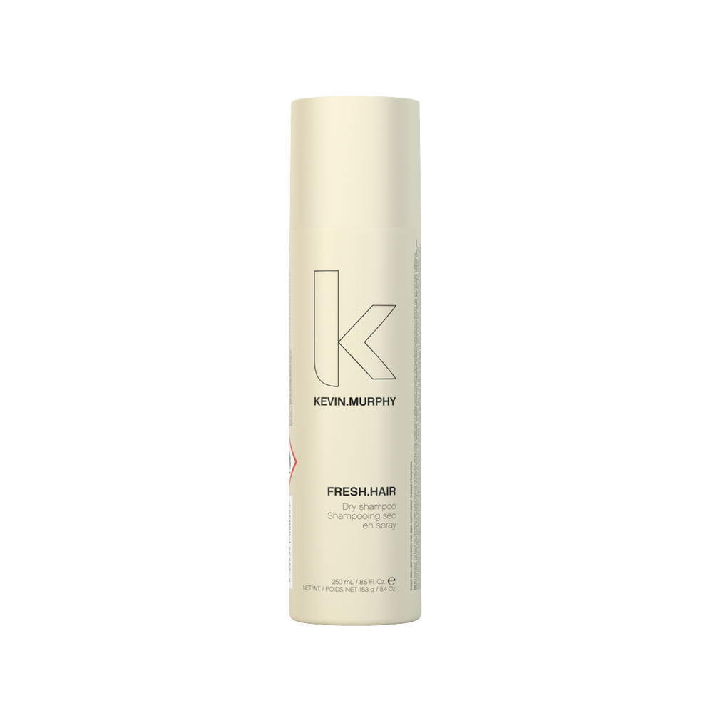 Flacon 250 ml du shampooing sec FRESH.HAIR Kevin Murphy posé sur fond clair