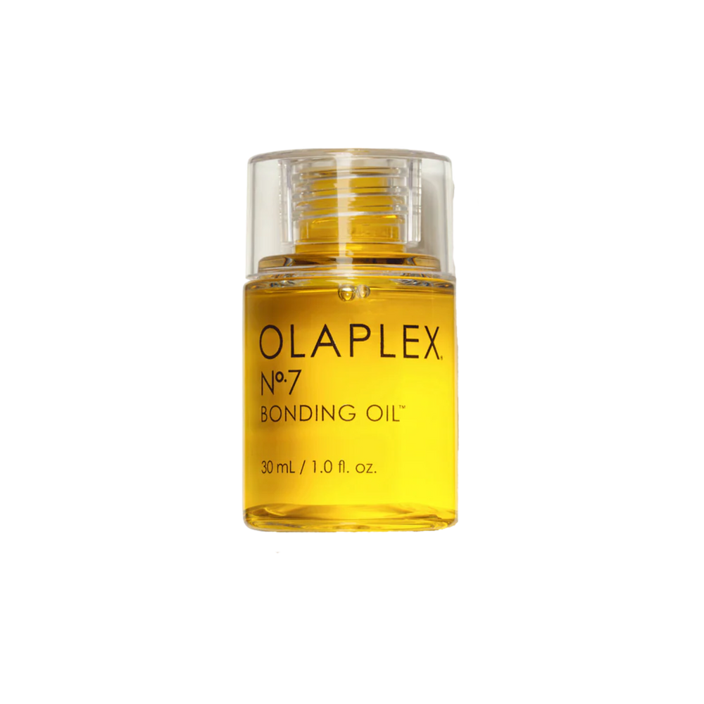 Flacon de l’huile coiffante Olaplex N° 7 Bonding Oil posé sur fond neutre