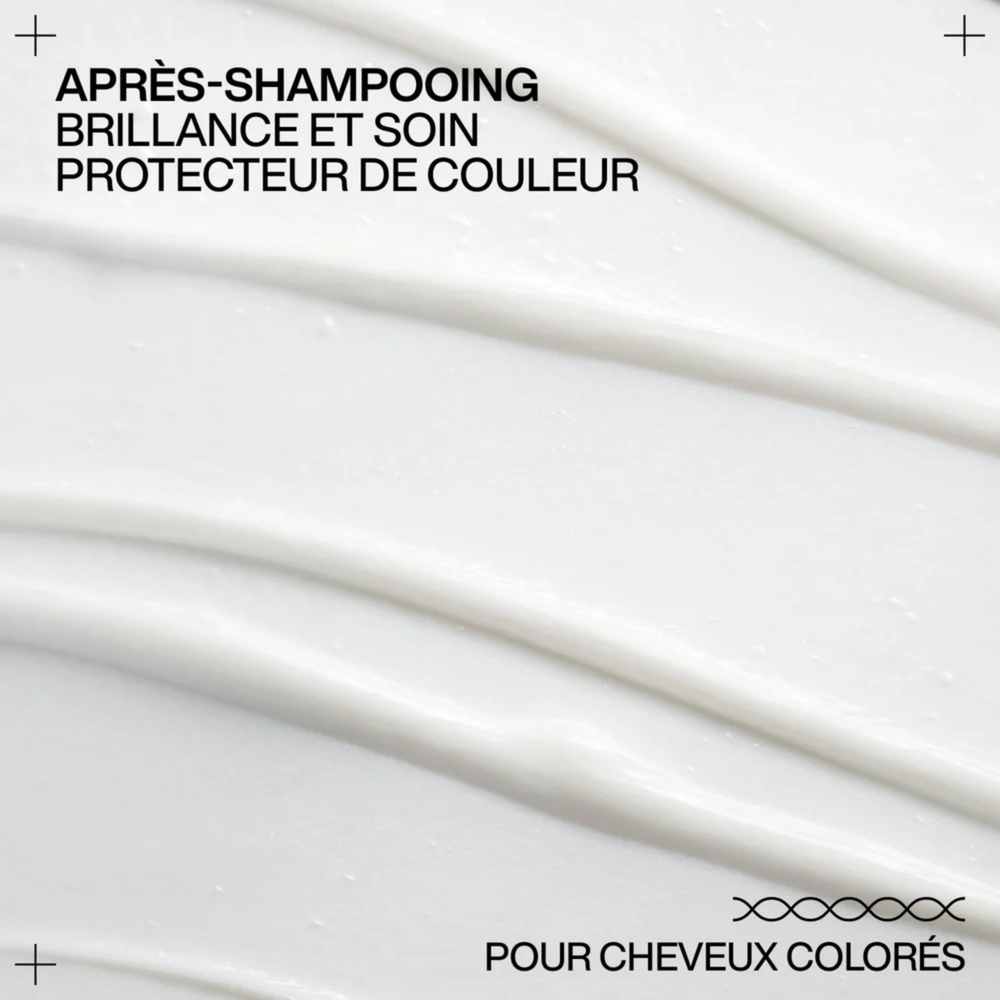 Flacon de l’après-shampooing Redken Acidic Color Gloss sur fond neutre, soin professionnel pour cheveux colorés