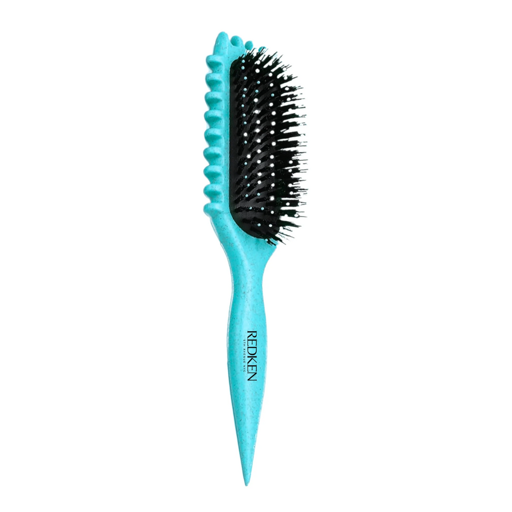 Brosse Redken Définition des Boucles turquoise avec picots souples, parfaite pour démêler et définir les boucles avec précision.