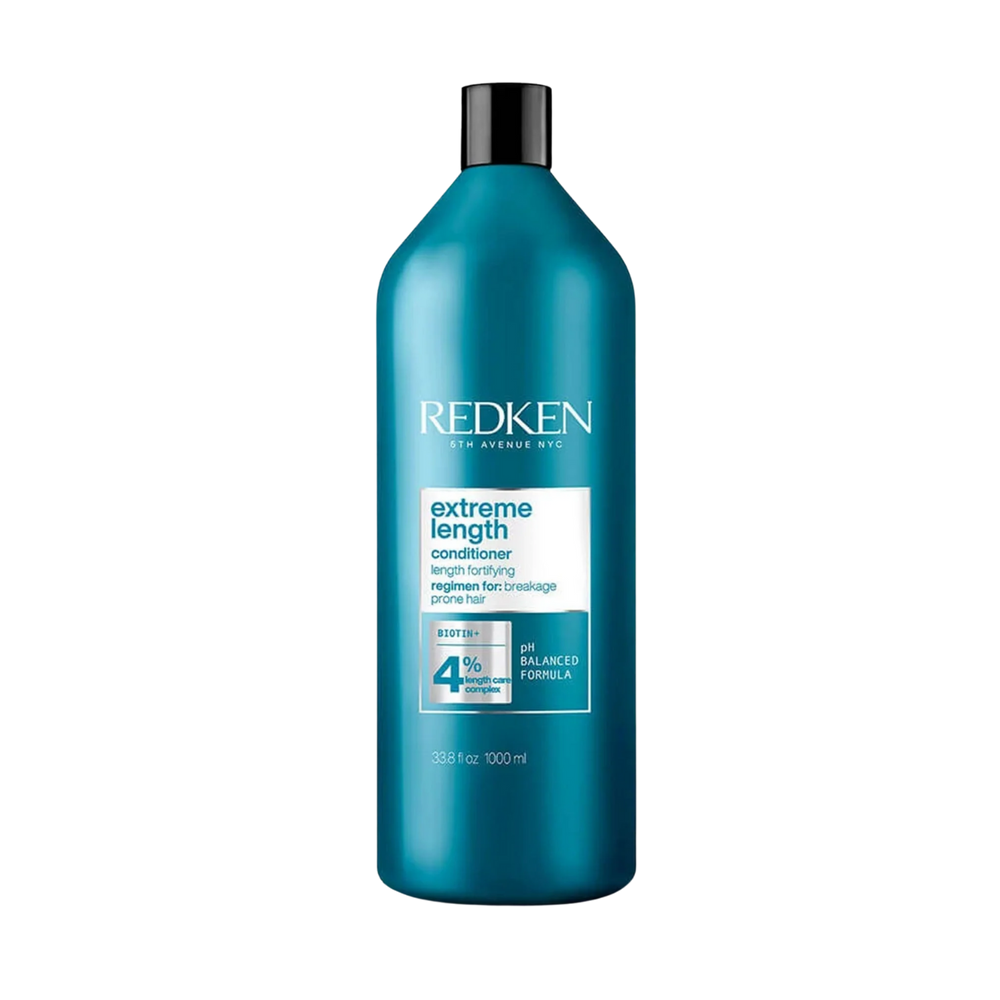 Flacon de Redken Extreme Length Conditioner, format revitalisant fortifiant enrichi en biotine et huile de ricin pour cheveux longs