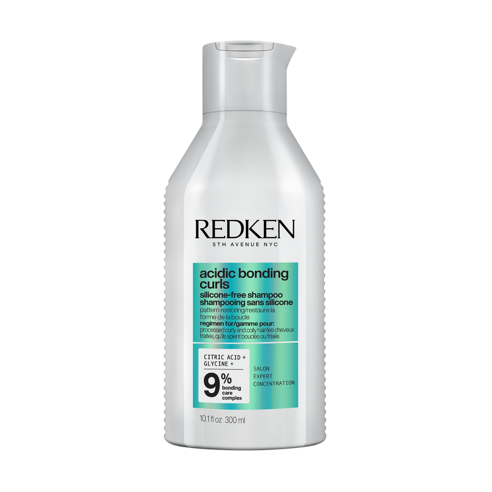 Flacon du shampooing Acidic Bonding Curls Redken pour cheveux bouclés, sans silicone.