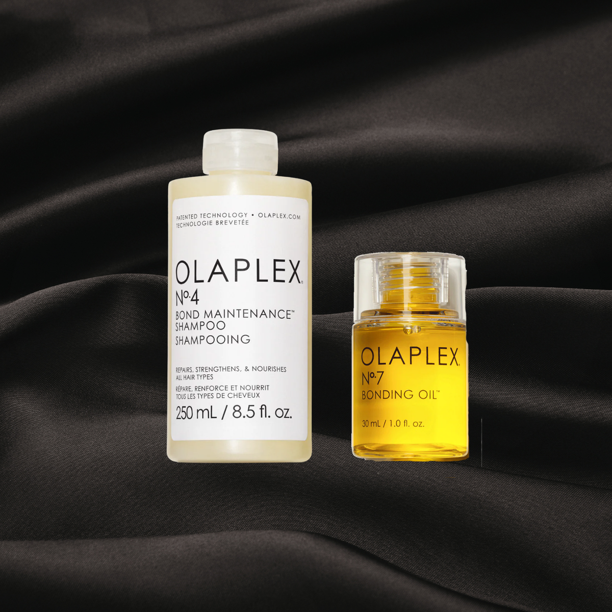 Ensemble de produit capillaire professionnel Olaplex sur fond noir satin