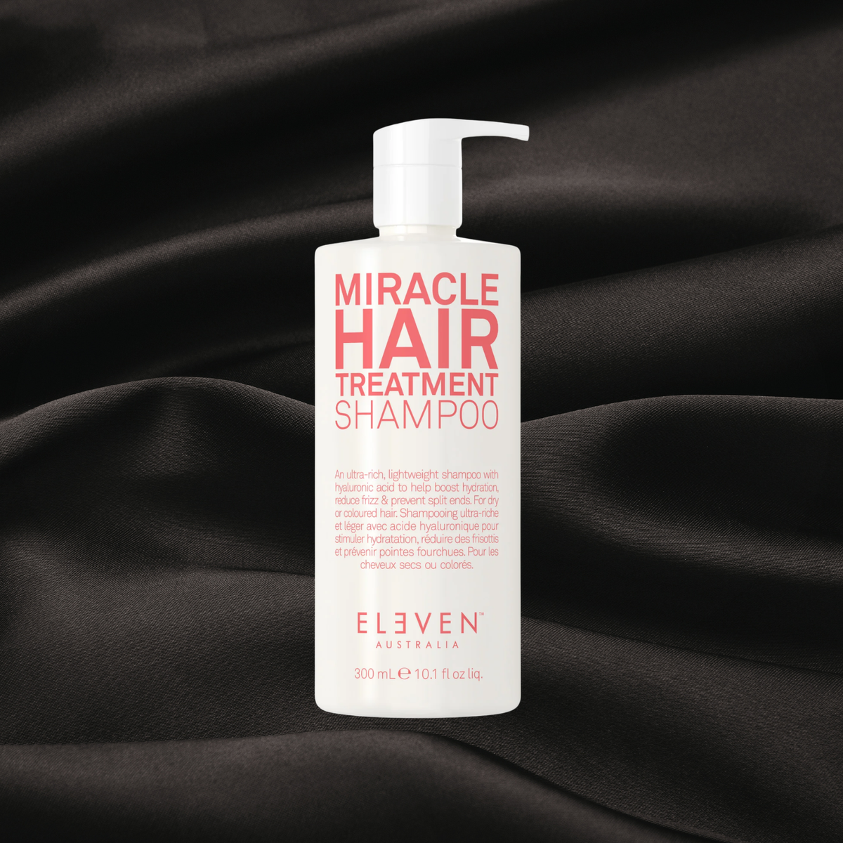 shampooing miracle hair treatment de Eleven disponible chez cachet urbain sur fond noir texture satin