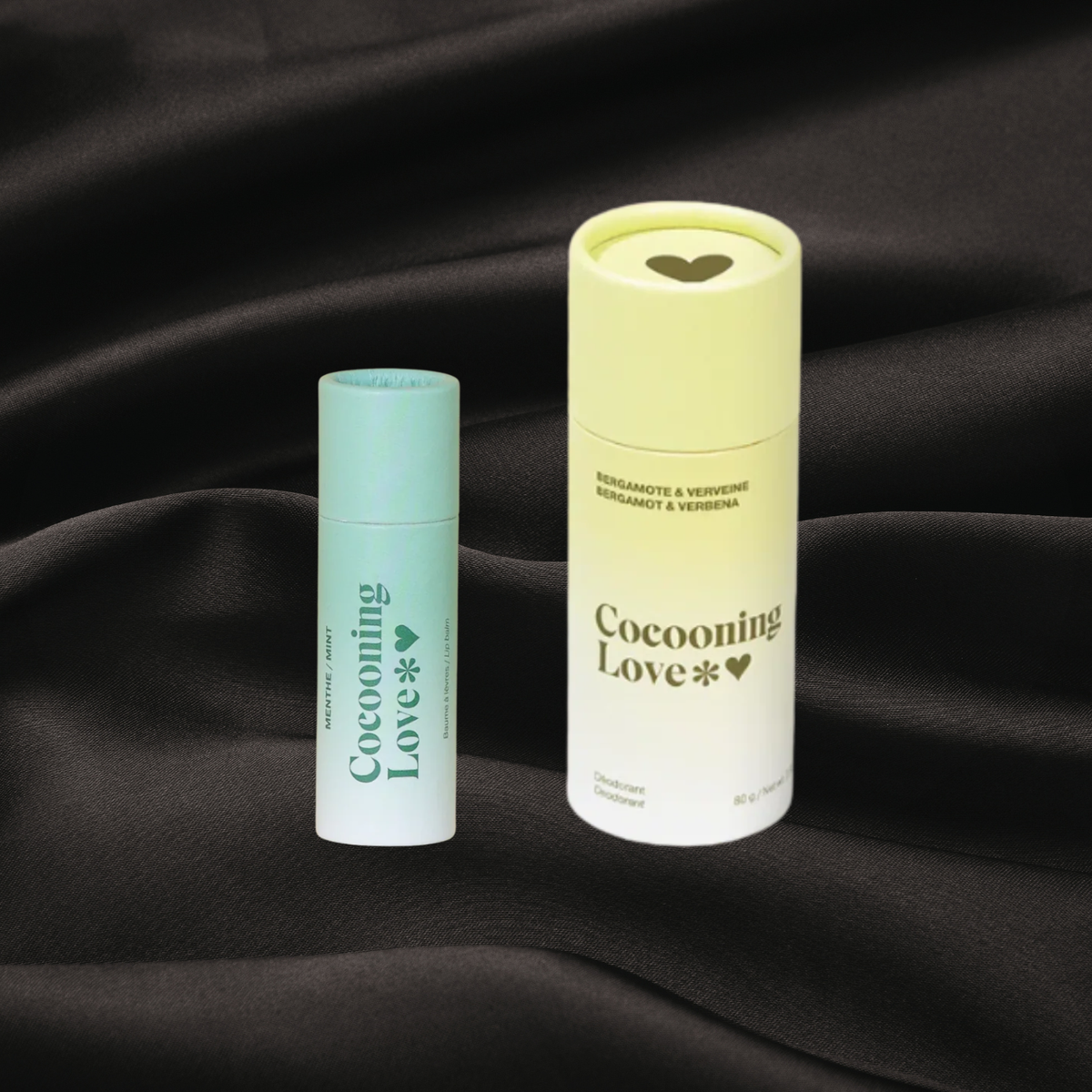 Baume à lèvres menthe & déodorant bergamote & verveine de Cocooning Love disponible chez Cachet Urbain sur fond noir texture satin