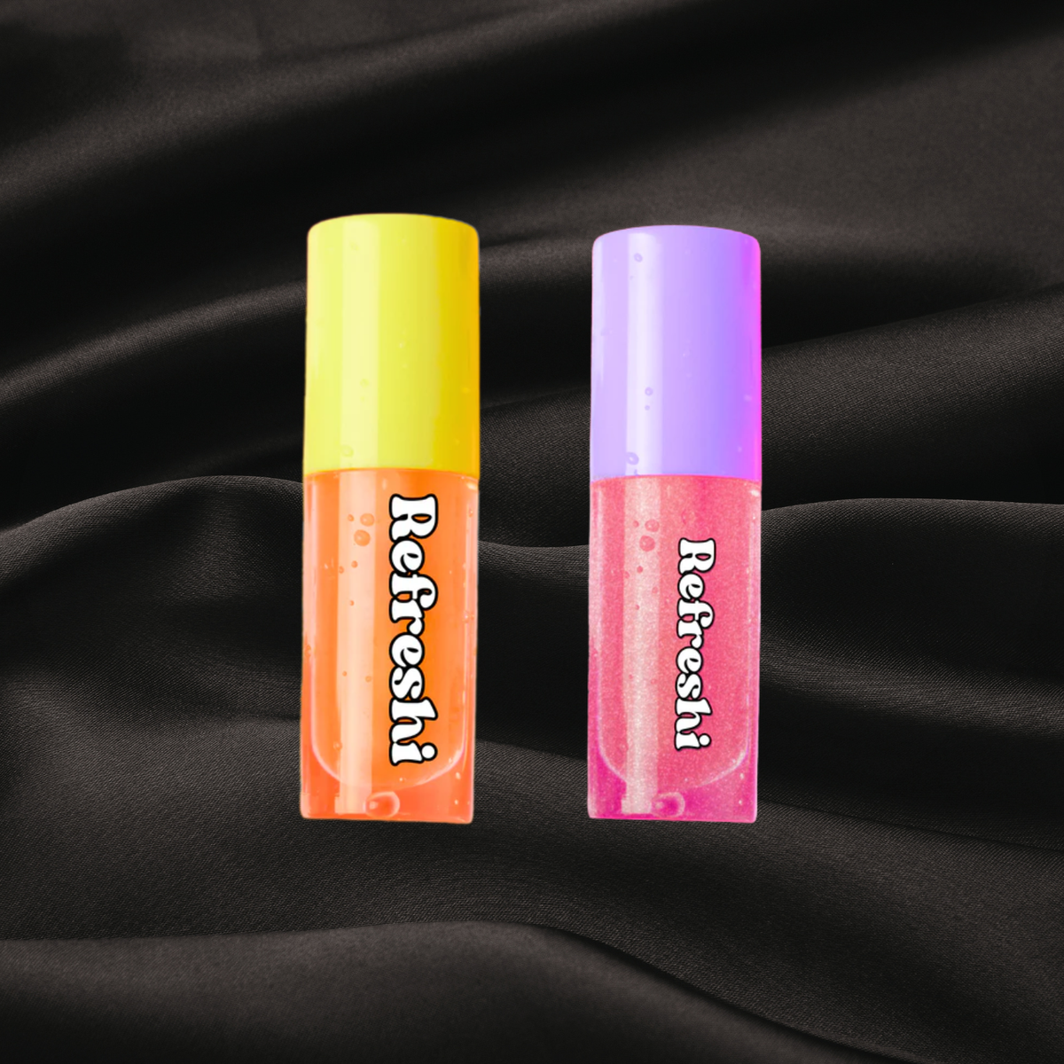lip oil orange, mangue et ananas, lip oil new me de la gamme refreshi disponible chez cachet urbain sur fond noir texture satin
