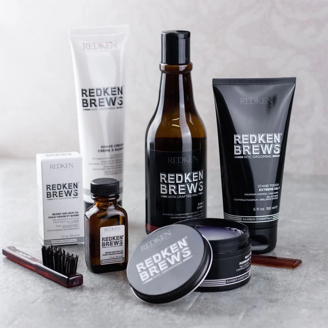 Pot de pommade crème Maneuver Redken Brews, texture légère, fini lisse, tenue modulable.