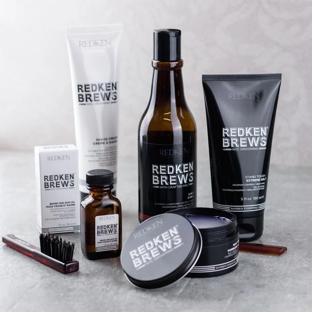 Pot de pommade crème Maneuver Redken Brews, texture légère, fini lisse, tenue modulable.