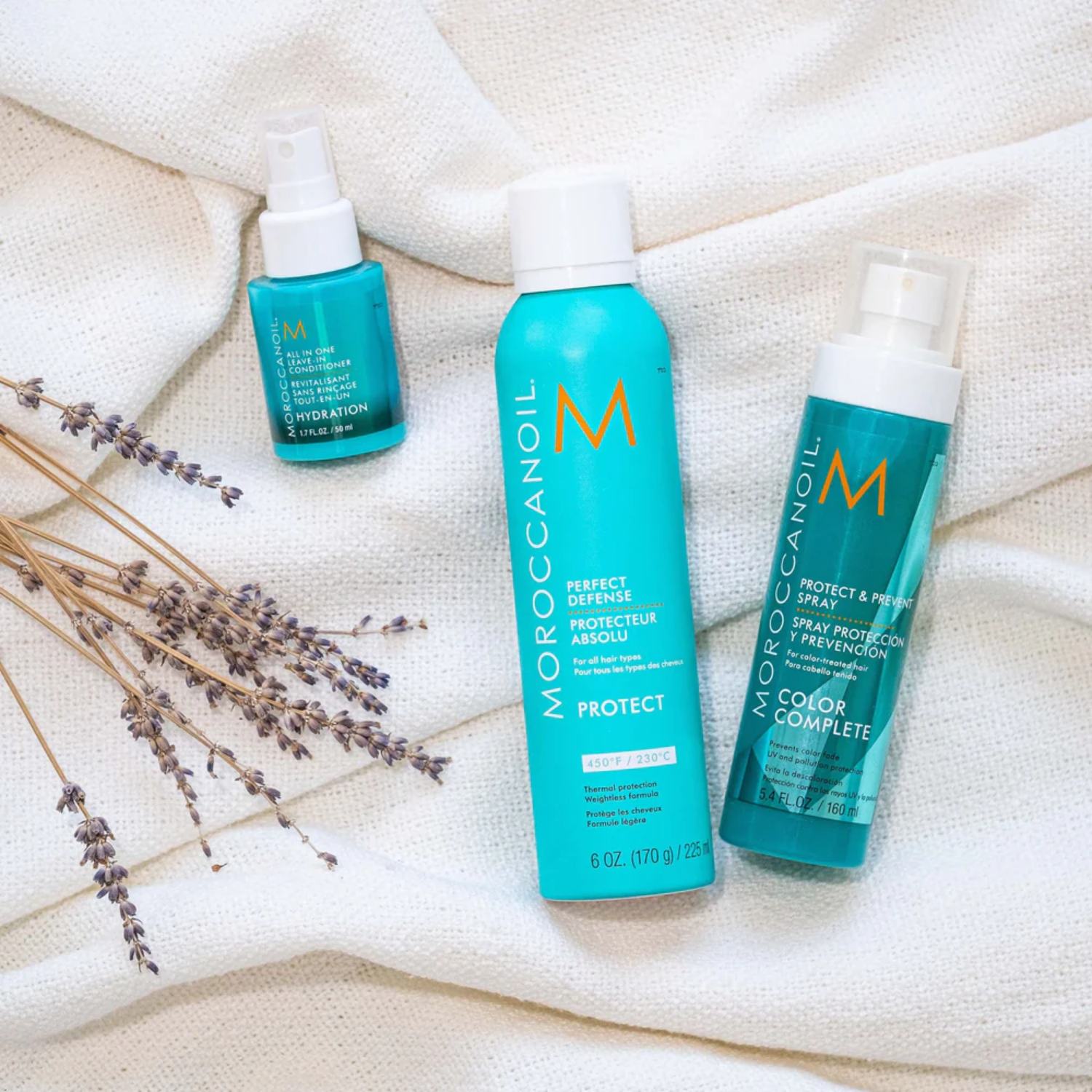 Bouteille de 160 ml de Moroccanoil Protect & Prevent Spray avec arôme signature et usage pour soin capillaire.

