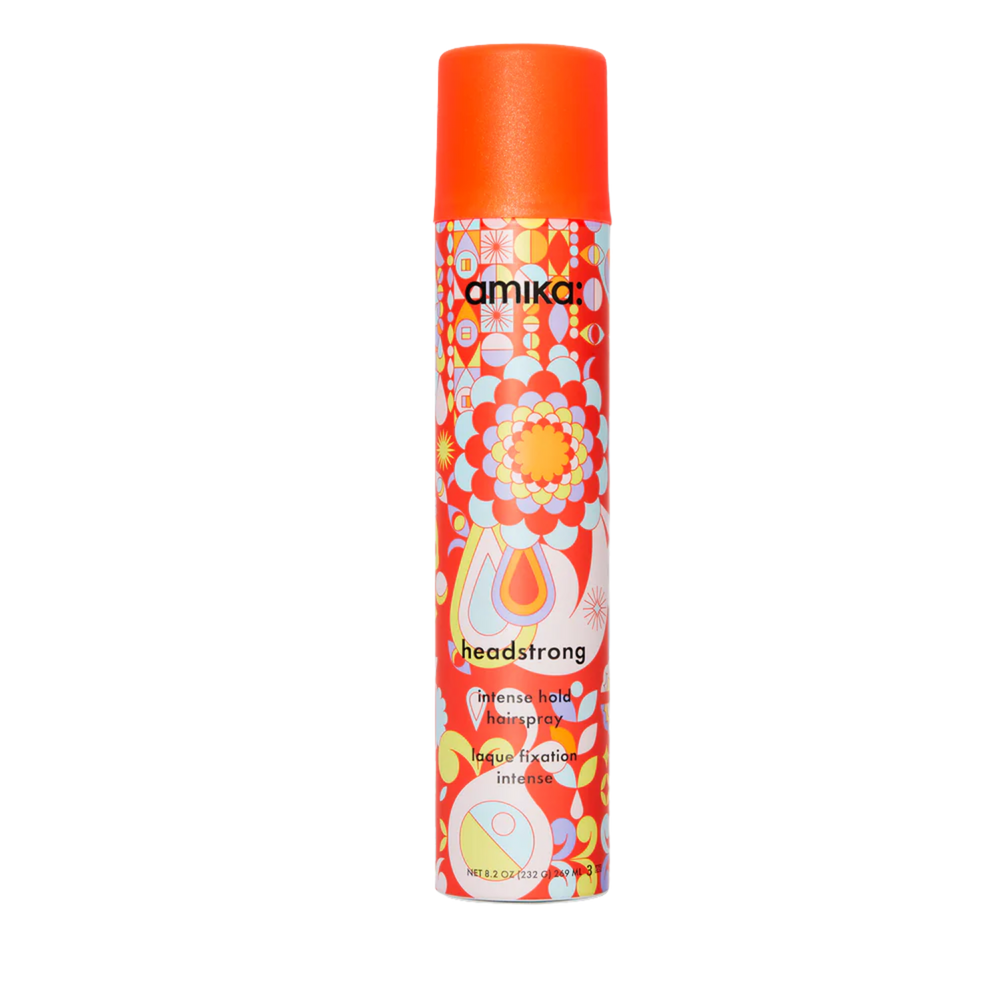 Spray Amika Headstrong Intense Hold 49 ml posé sur fond blanc

