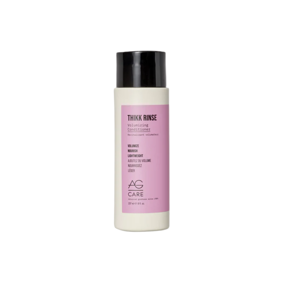 Flacon de 237 ml de l’après-shampoing volumisant AG Care Thikk Rinse posé sur fond blanc