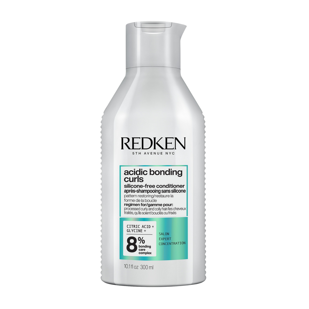 Flacon de l’après-shampooing sans silicone Acidic Bonding Curls de Redken pour cheveux bouclés définis et hydratés