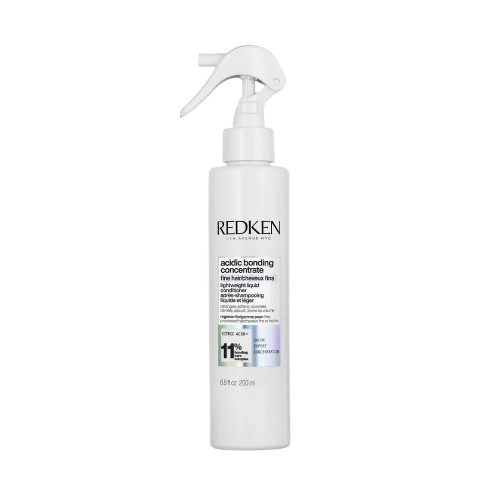 Flacon 200 ml de l’après-shampoing liquide léger Redken ABC sur fond blanc.