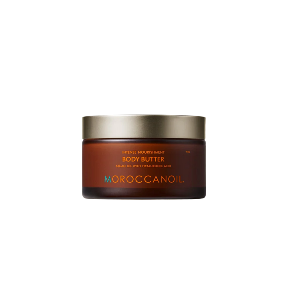 Pot de Baume Corps Moroccanoil : crème riche et nourrissante pour peau sèche, en pot de verre recyclable avec parfum signature.

