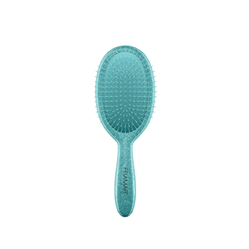 Brosse démêlante Framar Frosting avec manche pailleté givré et poils flexibles.