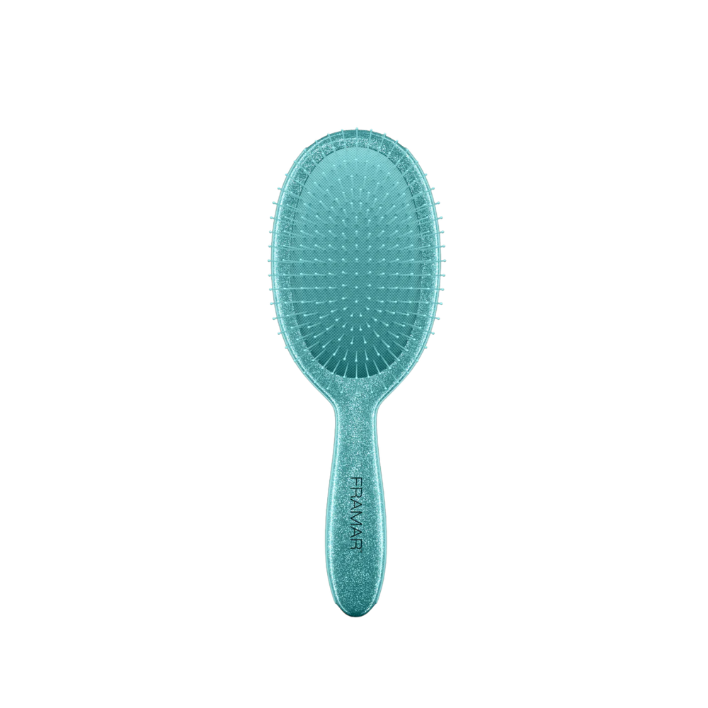 Brosse démêlante Framar Frosting avec manche pailleté givré et poils flexibles.