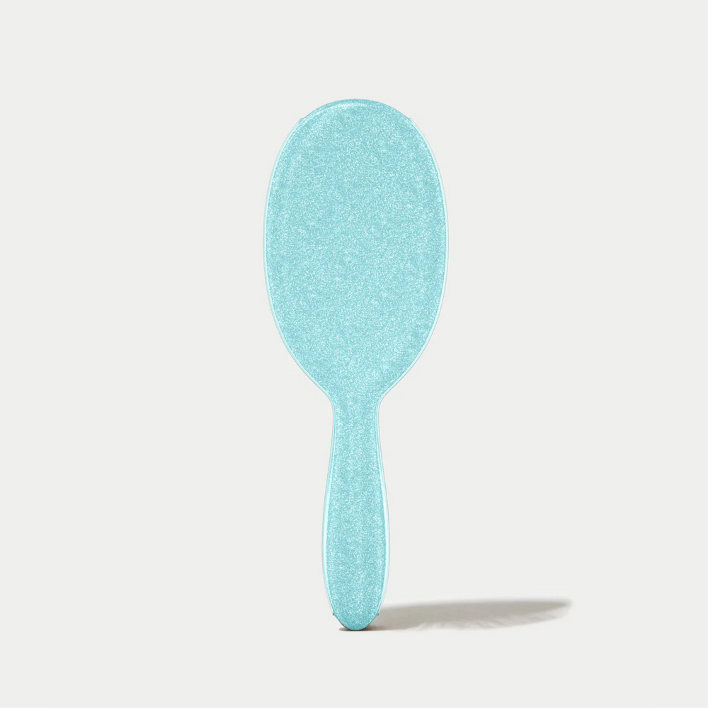 Brosse démêlante Framar Sprinkle avec manche confettis et poils souples à deux niveaux.