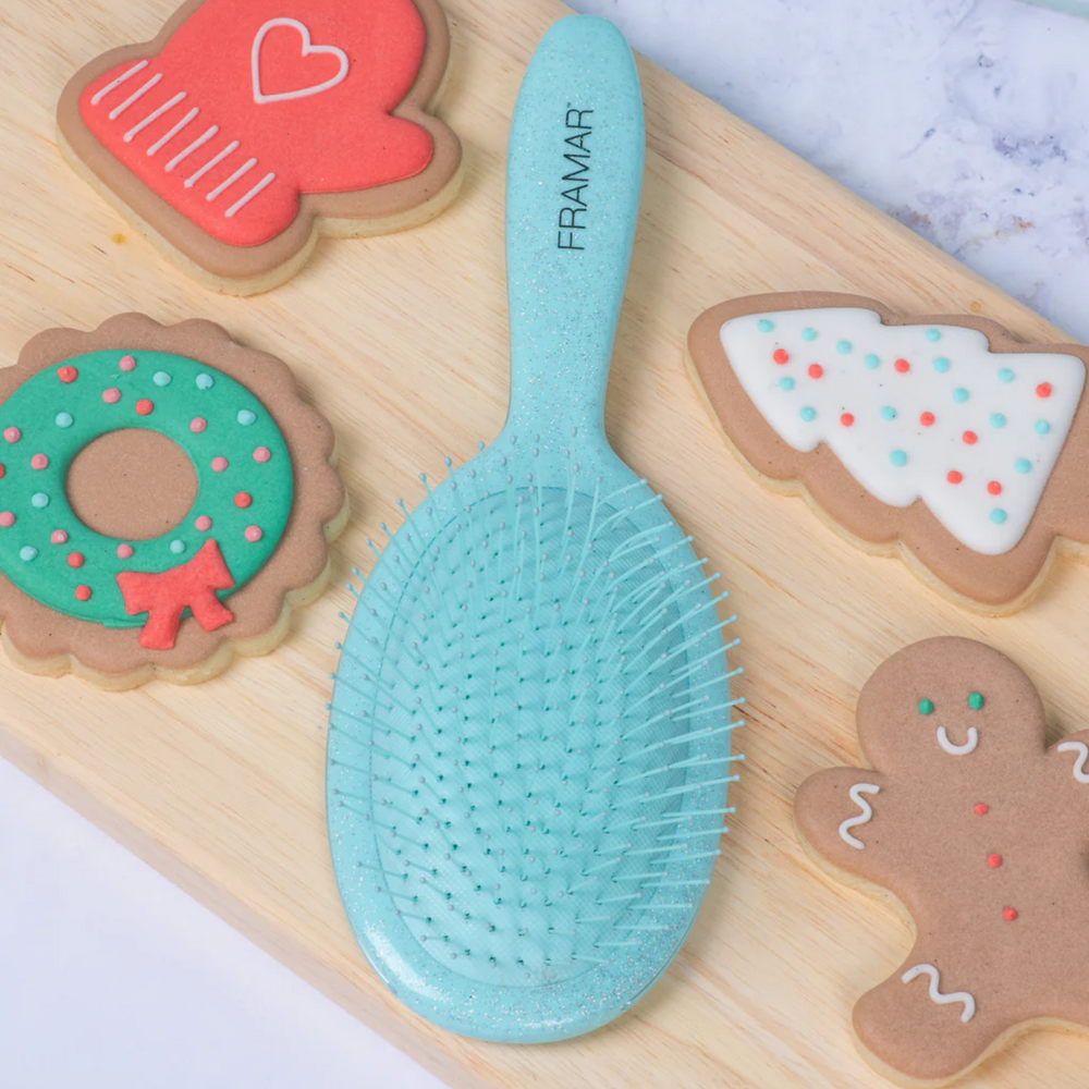 Brosse démêlante Framar Sprinkle avec manche confettis et poils souples à deux niveaux.
