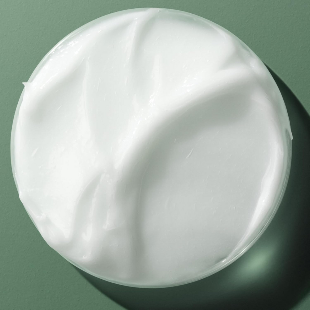Flacon de 250 ml de la brume de brillance et d’hydratation Biolage Smooth Shine Milk, soin capillaire sans rinçage.