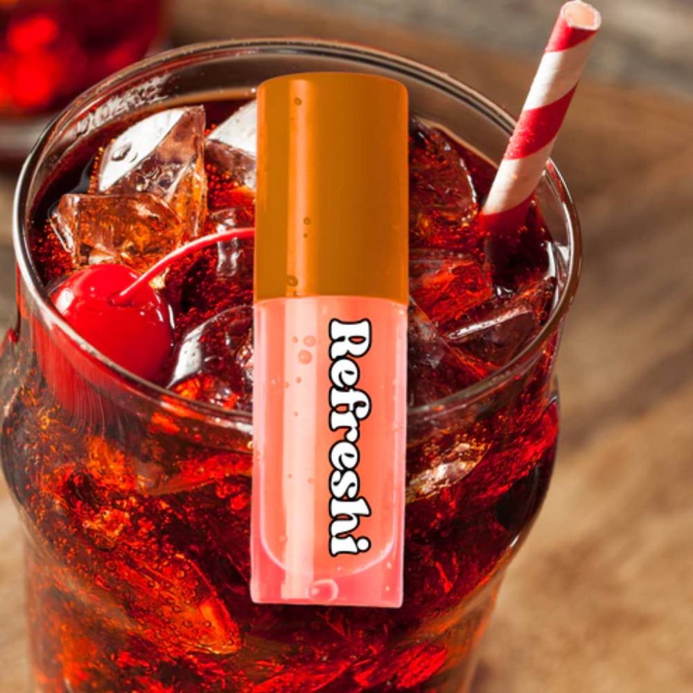 Tube 5 ml Cherry Cola Lip Oil Refreshi, texture brillante, parfum cerise-cola, bulles anti‑débordement, soin nourrissant vegan

