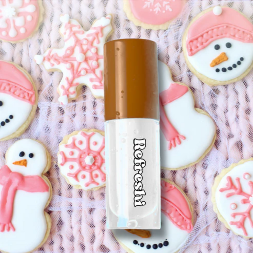 Tube 5 ml Christmas Cookie Lip Oil Refreshi, bulles dans le tube, parfum biscuits de Noël, texture brillante


