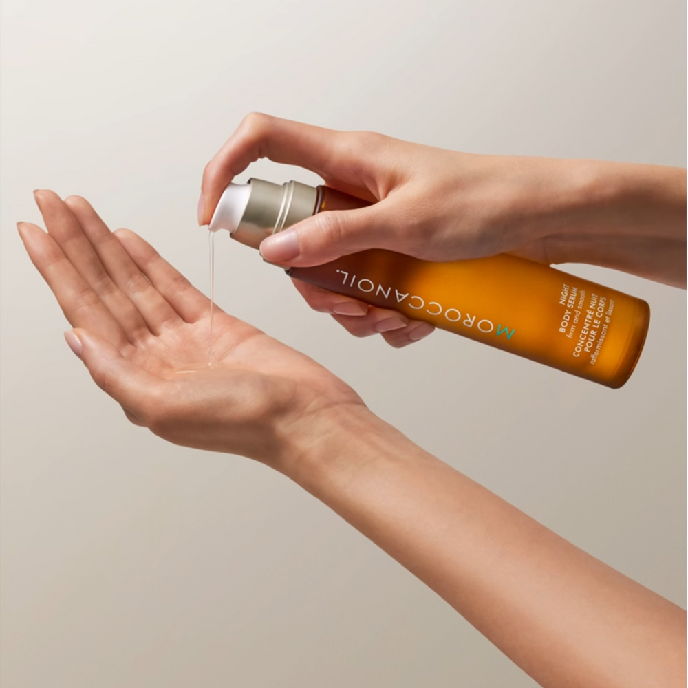 Flacon du Concentré Nuit Corps Moroccanoil, sérum corporel de nuit raffermissant et lissant à base d’argan, tsubaki et vitamine C ester.

