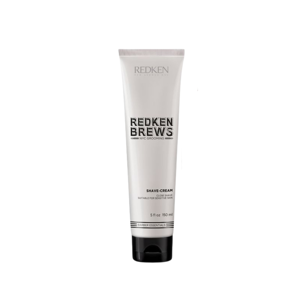 Tube de crème à raser Redken Brews, texture crème dense, conçu pour un rasage extra‑précis et peau sensible.
