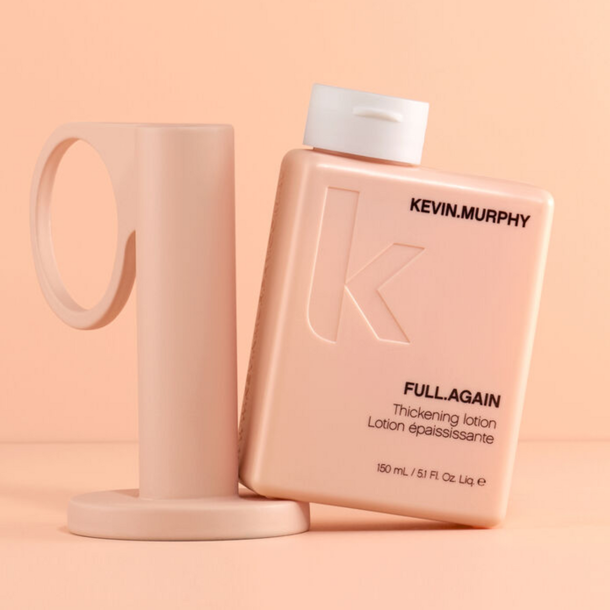 Flacon de la lotion épaississante FULL.AGAIN 150 ml de Kevin Murphy posé sur fond clair