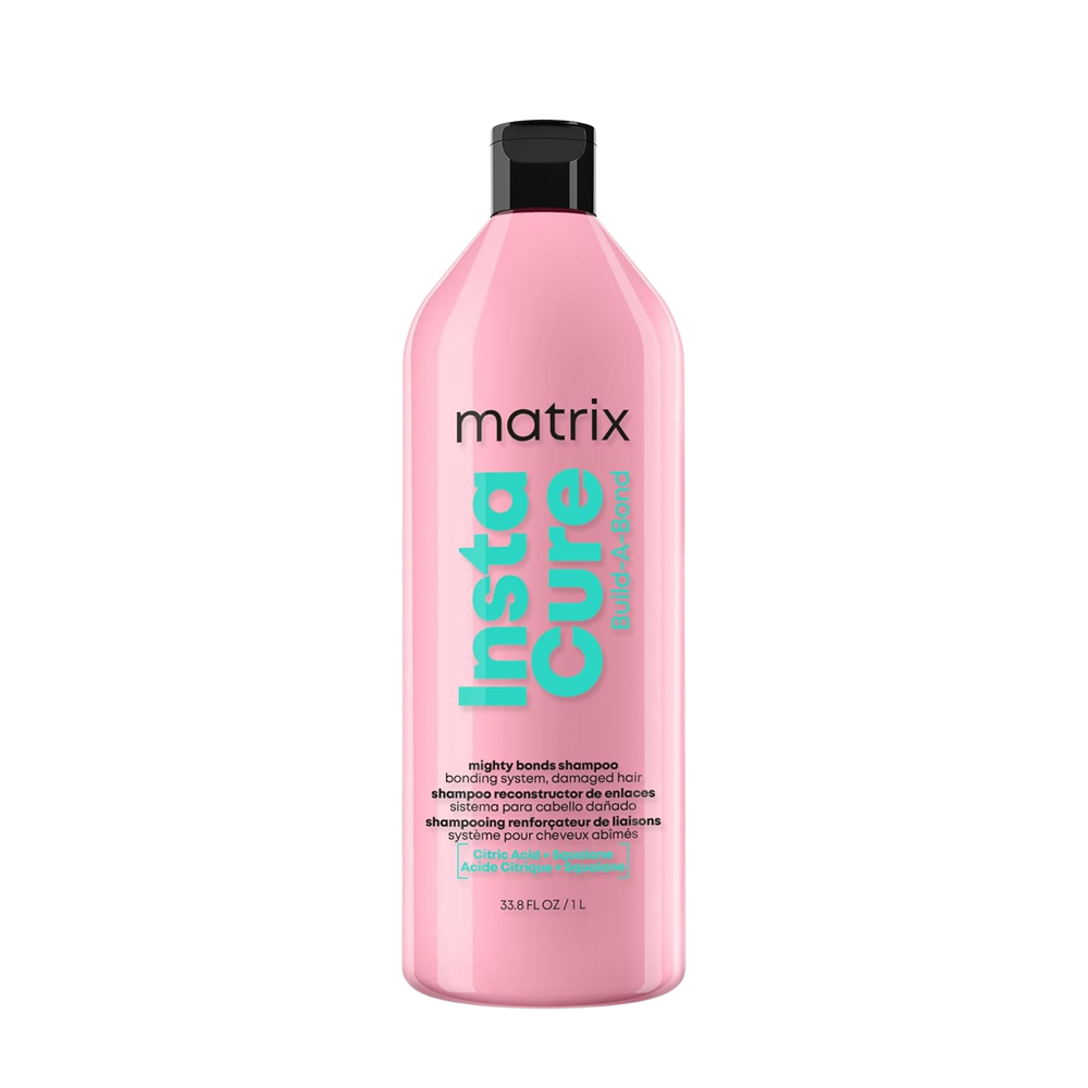“Flacon de shampoing Instacure Build‑A‑Bond Matrix — étiquette rose pâle avec logo Matrix”