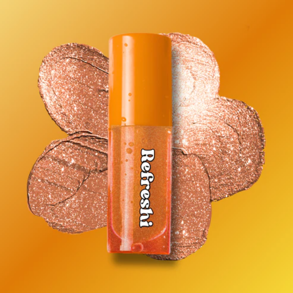Tube 5 ml Golden Glitter Tinted Lip Oil Refreshi, texture brillante agrémentée de paillettes dorées et parfum latte noisette

