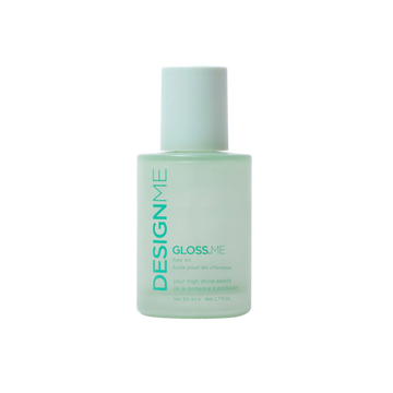 Bouteille élégante de l’huile Gloss.Me de Design.Me, formule légère qui nourrit, lisse et apporte brillance et éclat aux cheveux sans les alourdir.