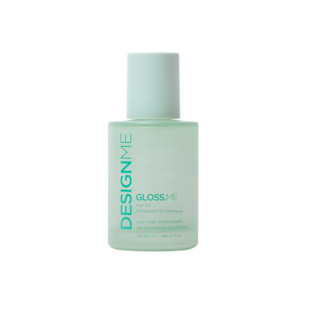 Bouteille élégante de l’huile Gloss.Me de Design.Me, formule légère qui nourrit, lisse et apporte brillance et éclat aux cheveux sans les alourdir.