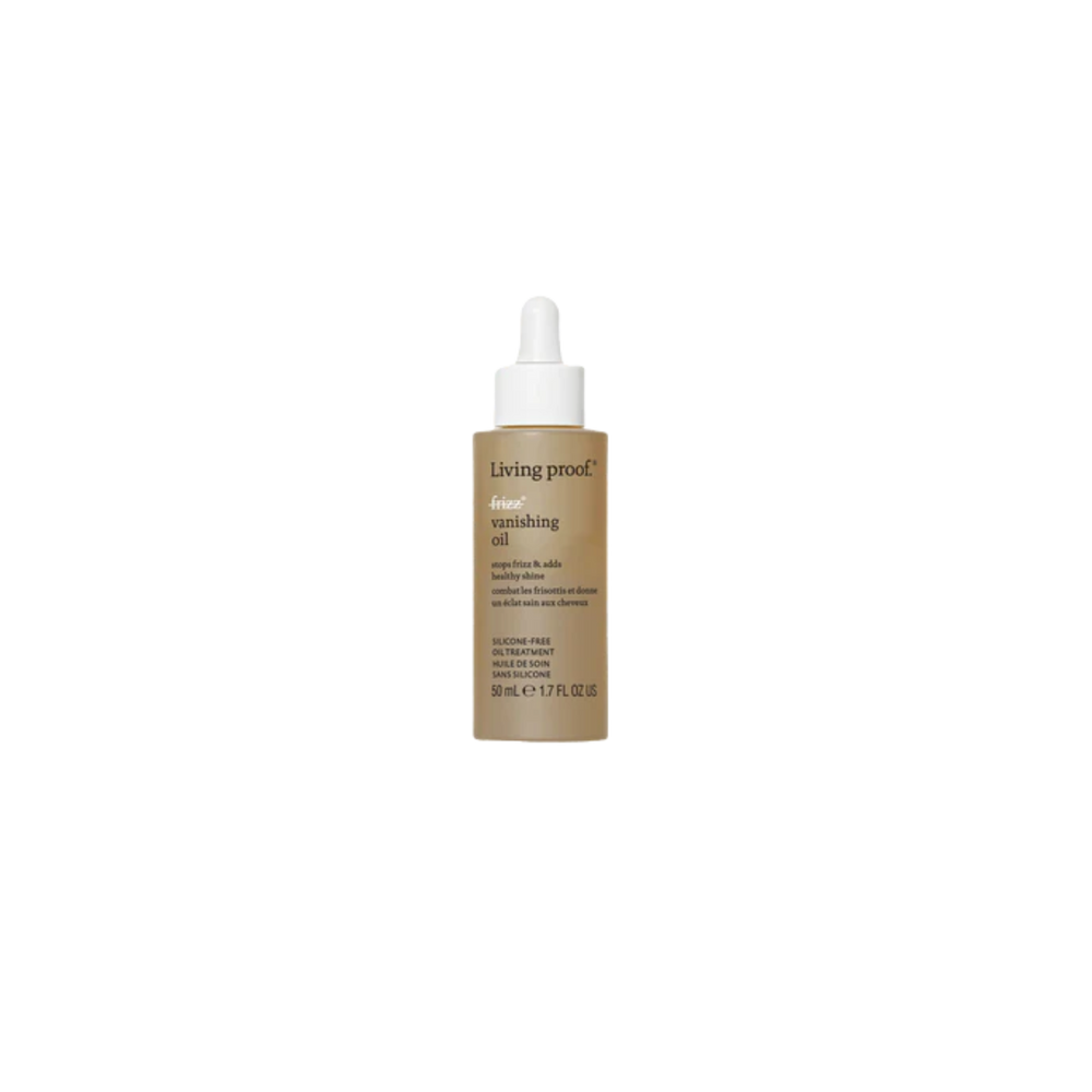 Flacon beige de l’huile No Frizz Vanishing Oil par Living Proof avec pipette, posé sur fond clair, évoquant légèreté, brillance et finesse capillaire.

