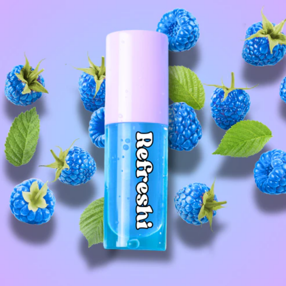 Tube d’huile à lèvres Framboise Bleue Refreshi sur fond bleu vif, fini glossy fruité


