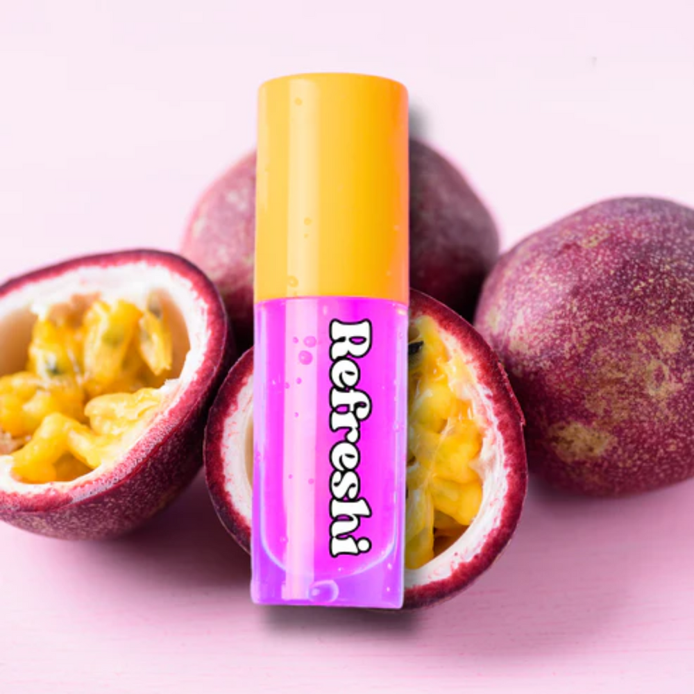 Tube d’huile à lèvres Fruit de la Passion Refreshi devant fruits exotiques, fini glossy lumineux

