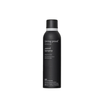 Flacon noir mat de la laque Style Lab Control Hairspray de Living Proof posé sur fond sombre, illustrant finition nette, tenue contrôlée et effet soyeux.

