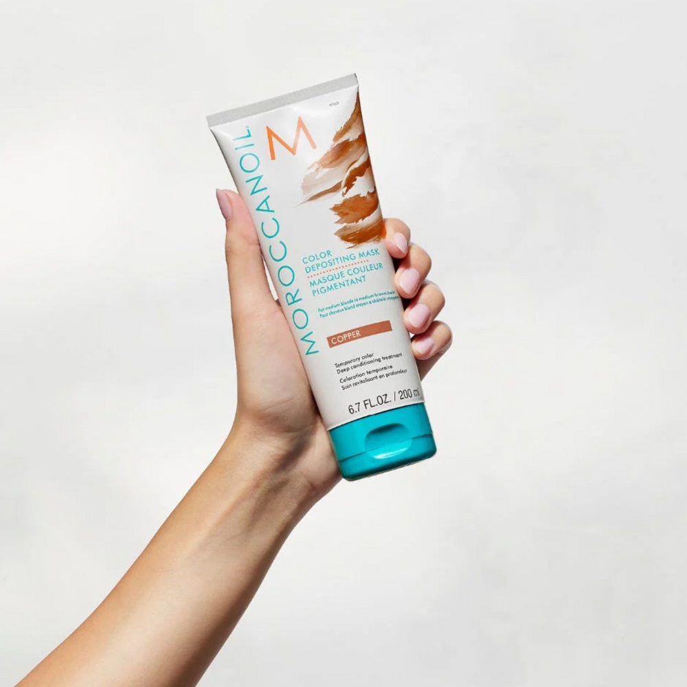 Pot de Masque Cuivre Moroccanoil Dépôt de Couleur : soin capillaire temporaire cuivré pour cheveux châtains à blonds foncés.

