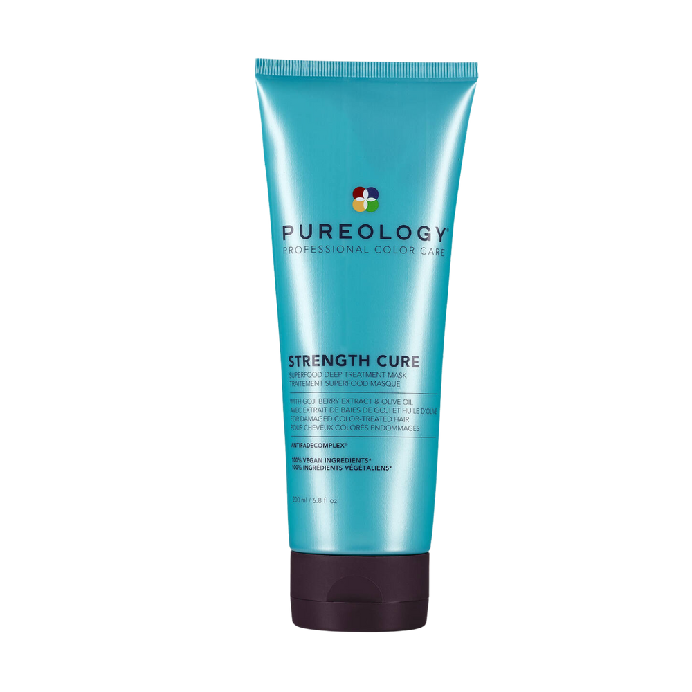 Tube ou pot de masque Strength Cure Superfood de Pureology, avec étiquette élégante et ingrédients naturels en arrière‑plan.