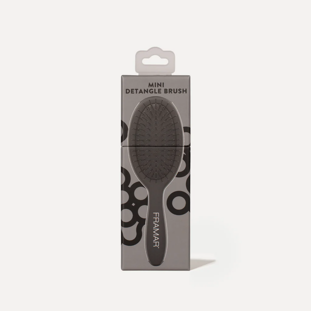 Mini brosse Framar noire, poils souples et flexible, idéale pour démêler en déplacement.