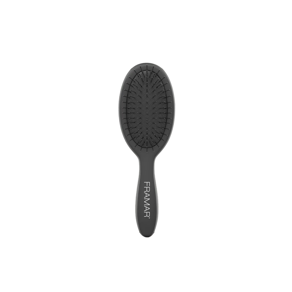 Mini brosse Framar noire, poils souples et flexible, idéale pour démêler en déplacement.
