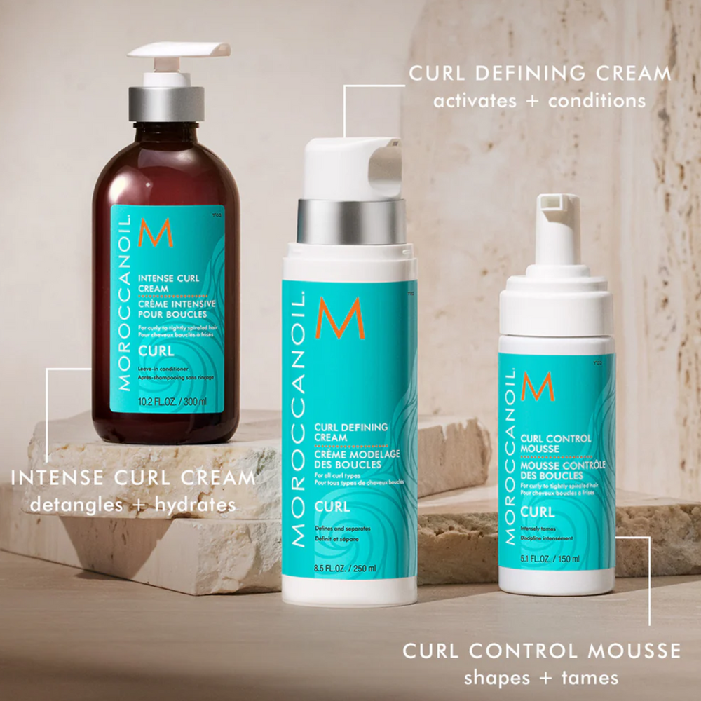 Flacon de la Mousse Contrôle des Boucles Moroccanoil, mousse coiffante légère pour boucles serrées, ondulées ou frisées.

