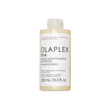 Flacon du shampooing Olaplex N° 4 Bond Maintenance placé sur fond neutre