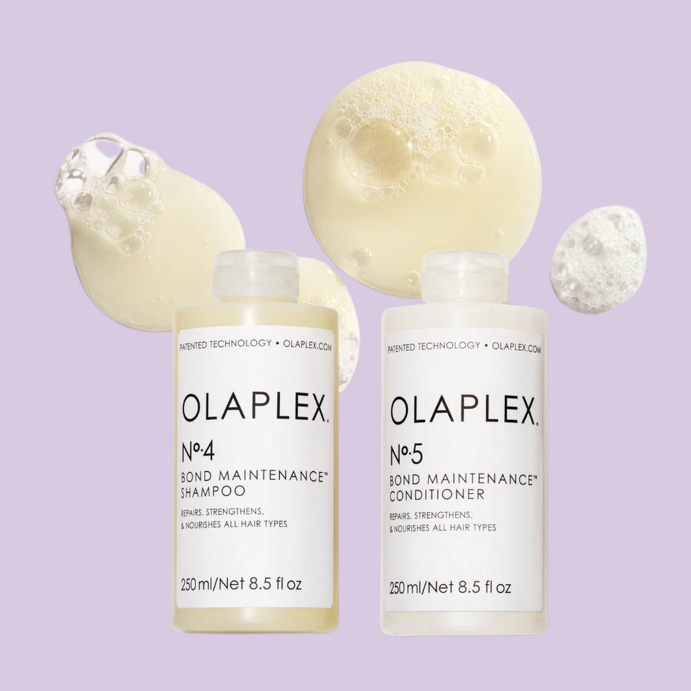 Flacon du shampooing Olaplex N° 4 Bond Maintenance placé sur fond neutre