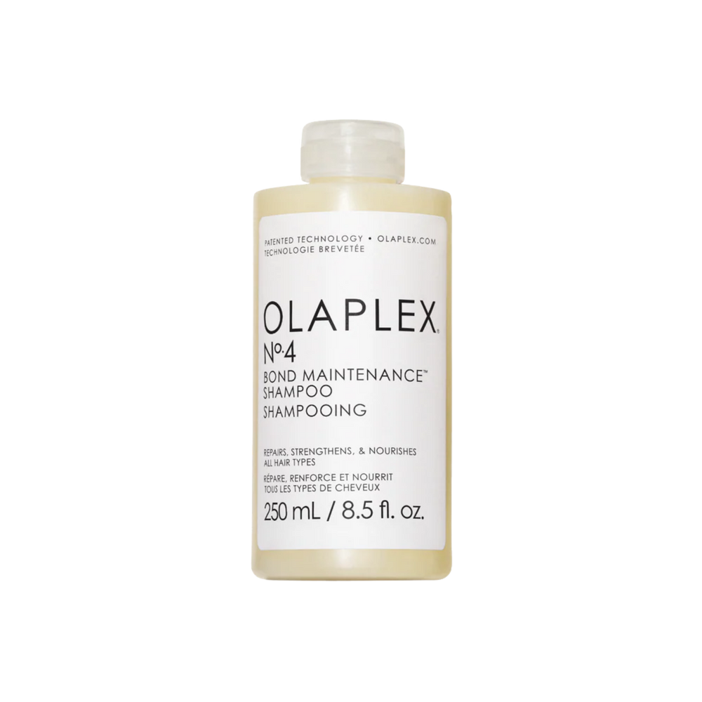 Flacon du shampooing Olaplex N° 4 Bond Maintenance placé sur fond neutre