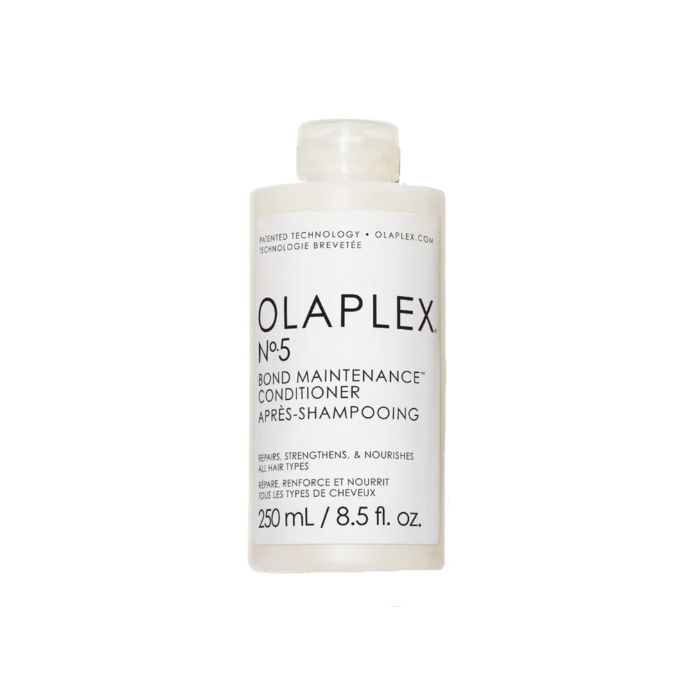 Flacon du conditionneur Olaplex N° 5 Bond Maintenance posé sur fond neutre