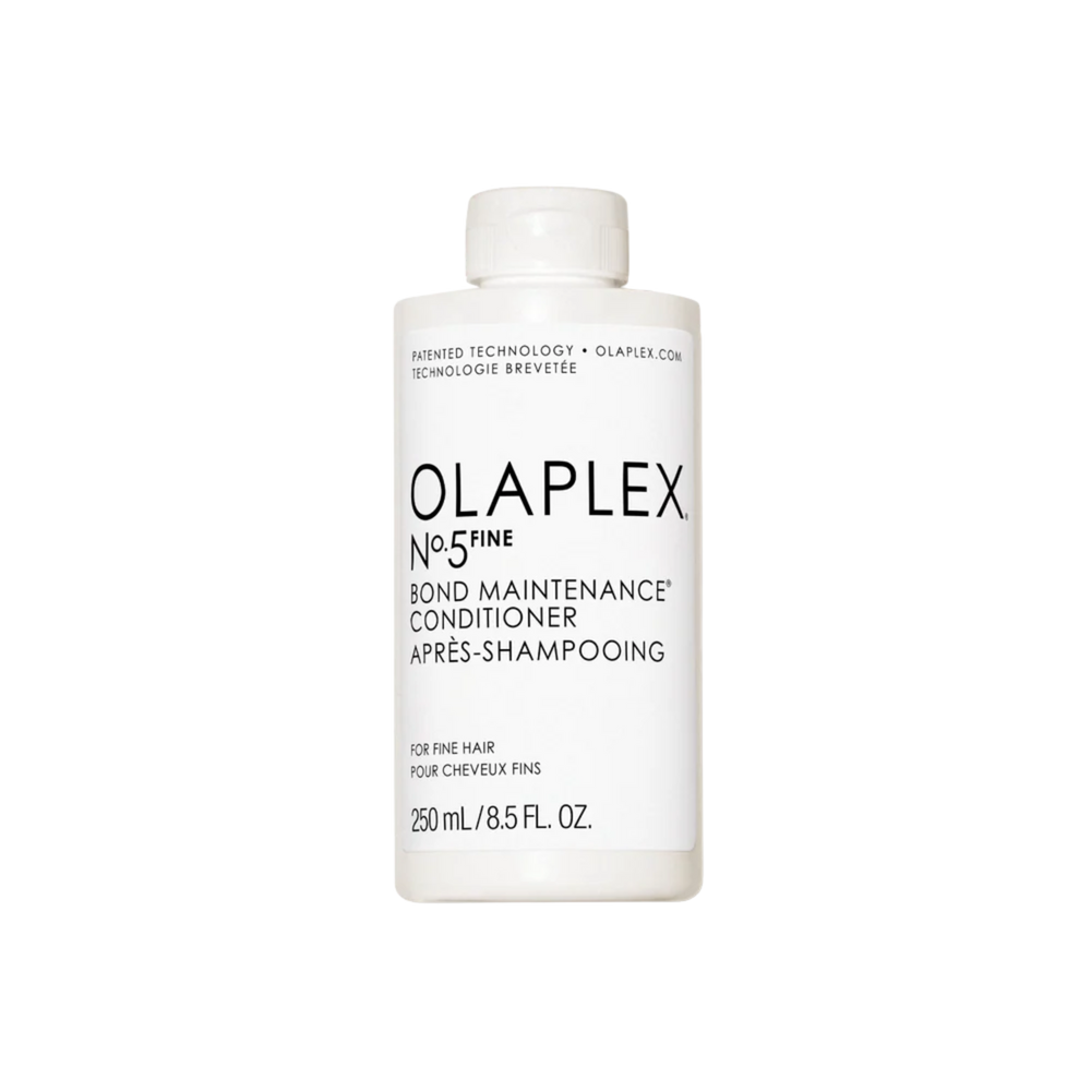 Flacon du conditionneur Olaplex N° 5 Fine Bond Maintenance posé sur fond neutre