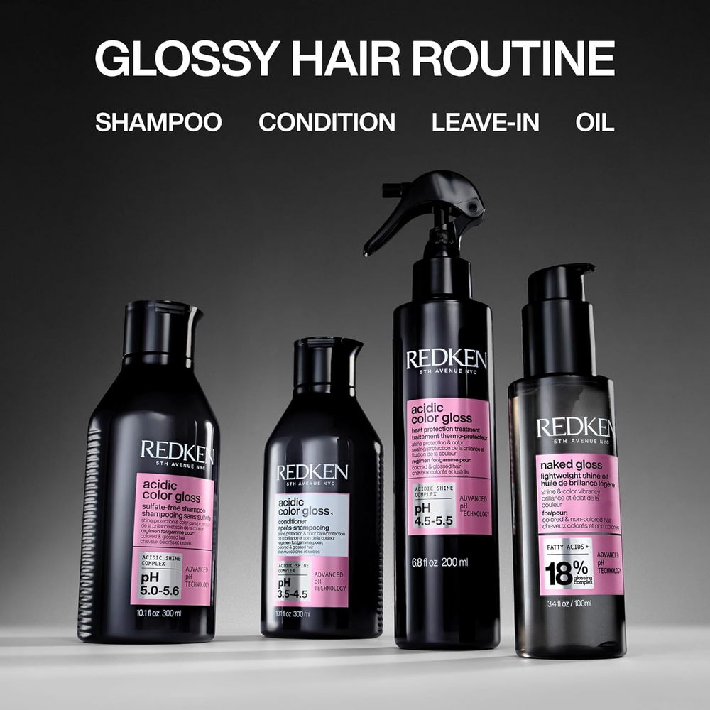 Spray thermo‑protecteur Acidic Color Gloss de Redken sur fond neutre, flacon élégant prêt à sublimer les cheveux colorés